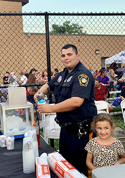 Elmwood Park police officer assisting in the community